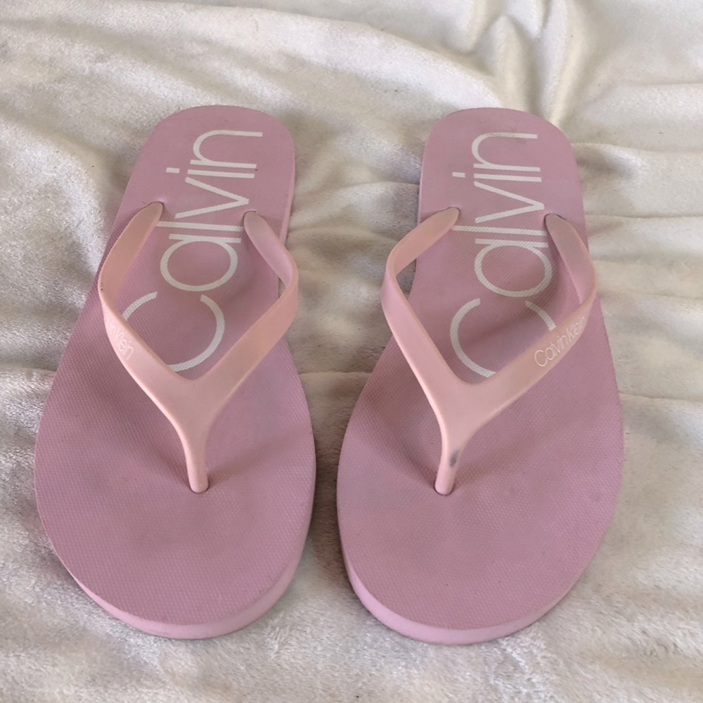 Calvin Klein Flip Flops. Good condition-some wear as shown size is 7/8. Medium